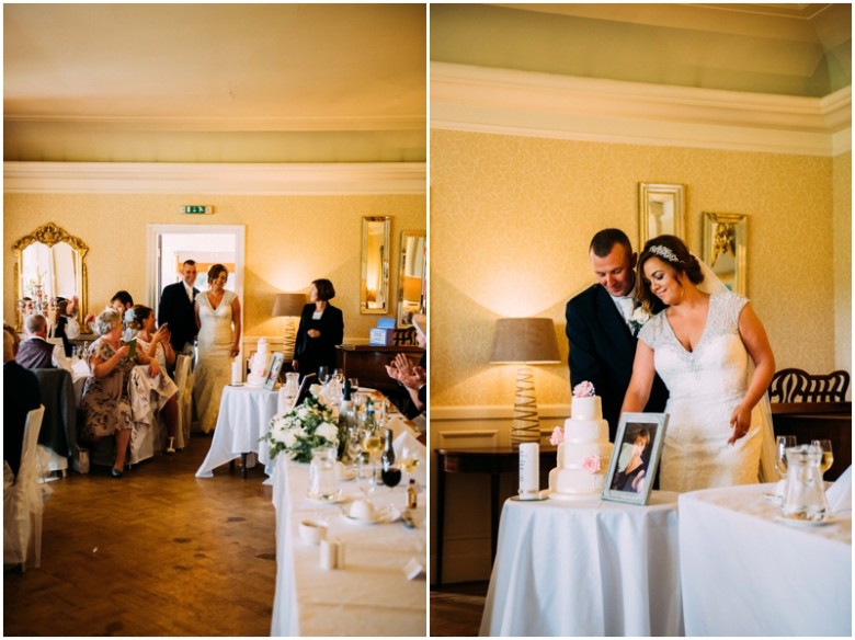 bride and groom cutting the wedding cake