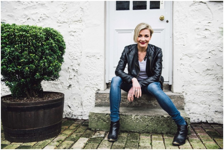 female model natural light portrait image in leather jacket