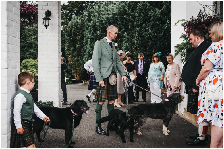 groom and his dogs