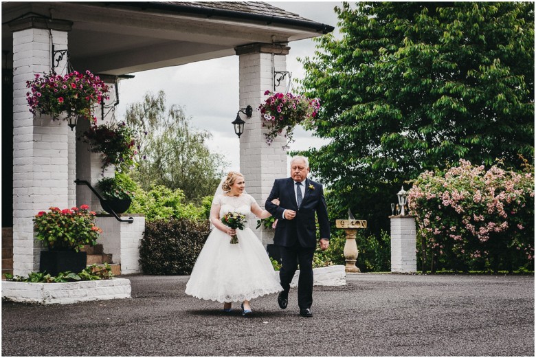 bride and her dad walking down the aisle