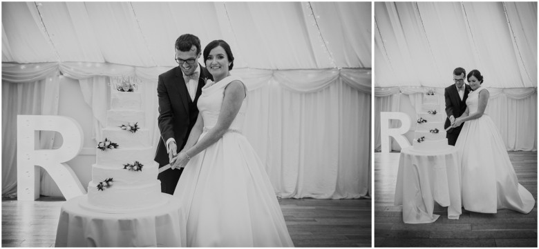 bride and groom cutting their wedding cake