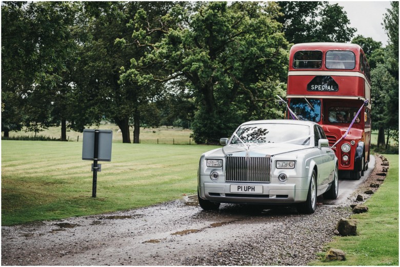 guests arriving for the wedding reception in an old london bus