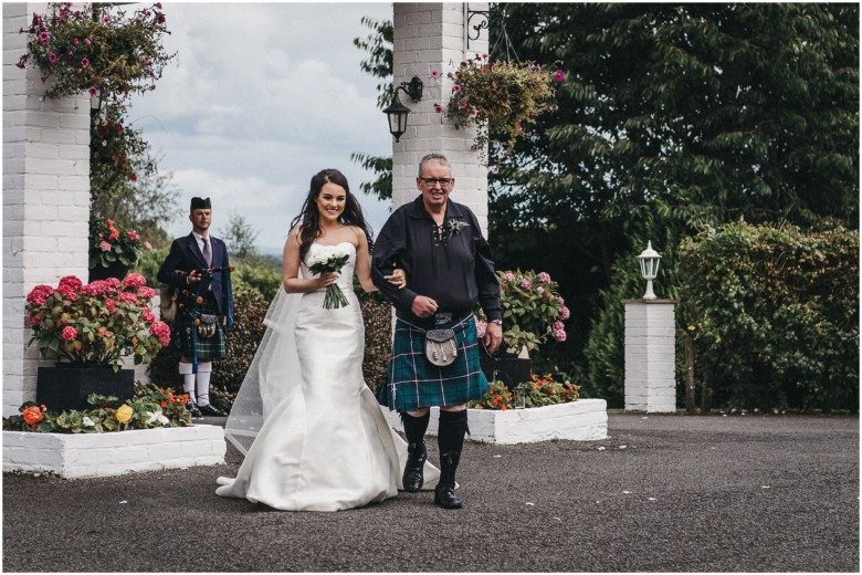 bride and her dad walking down the aisle