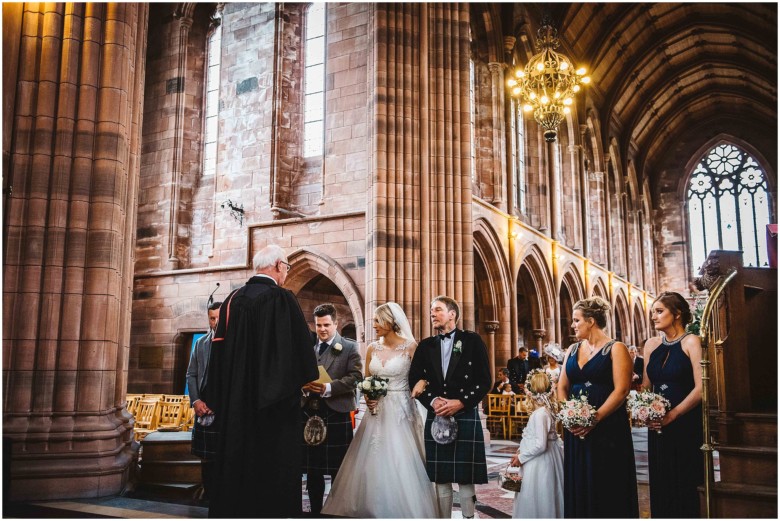 bride and groom at their wedding ceremony in a church