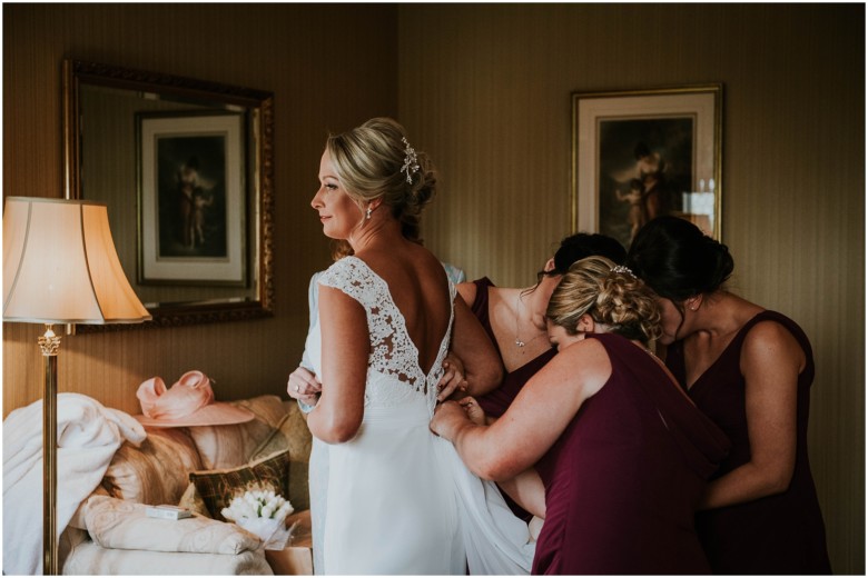 bride and her bridesmaids getting ready