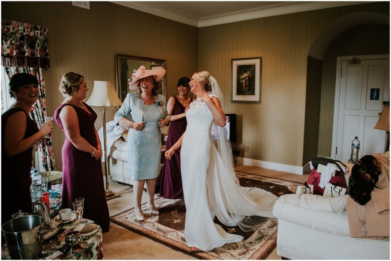 bride and her bridesmaids getting ready