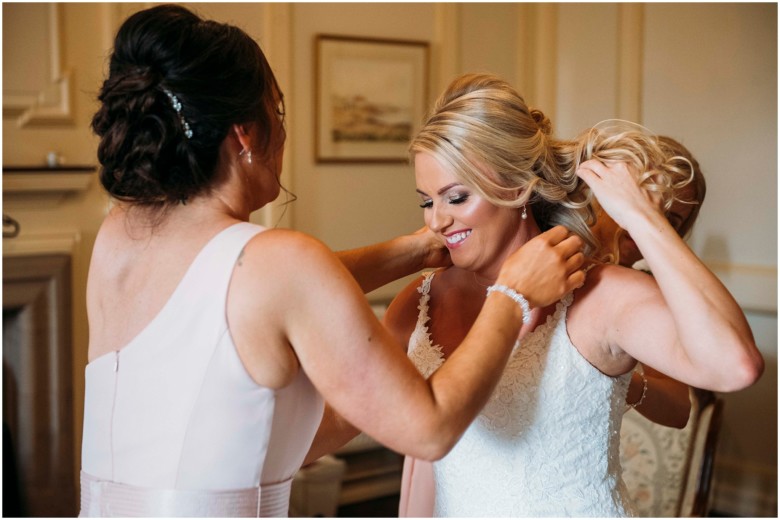 bride and her bridesmaids getting ready