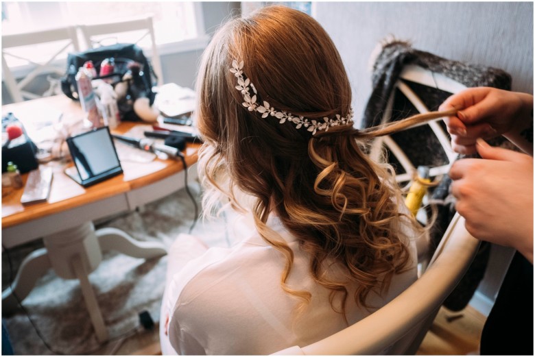 bride and her bridesmaids getting ready for the wedding