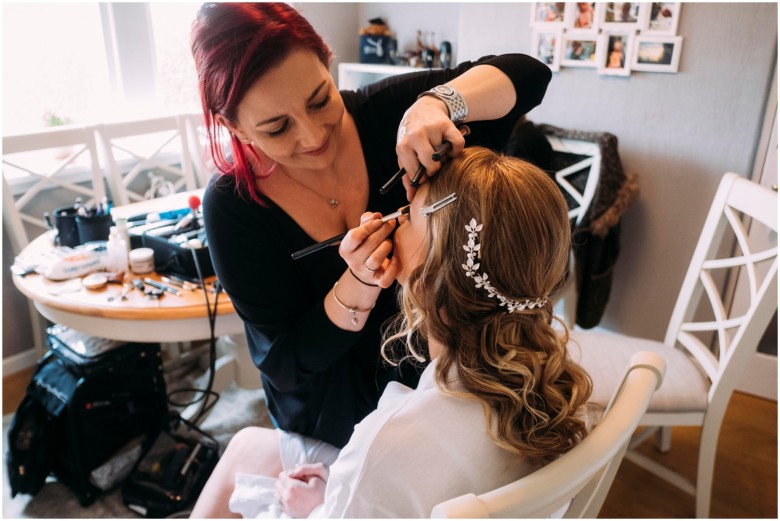 bride and her bridesmaids getting ready for the wedding