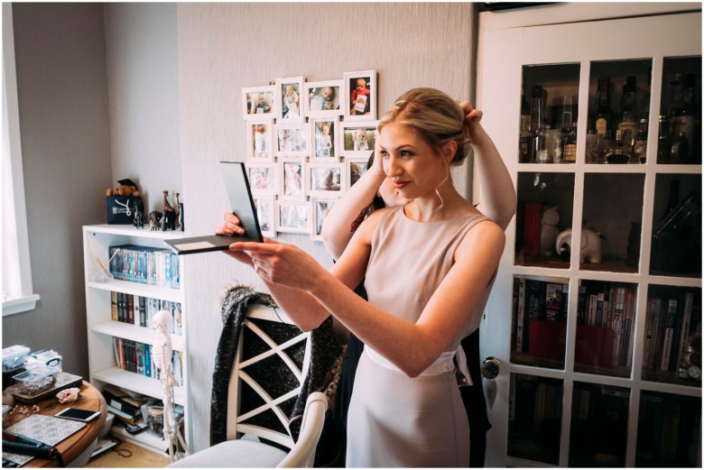 bride and her bridesmaids getting ready for the wedding