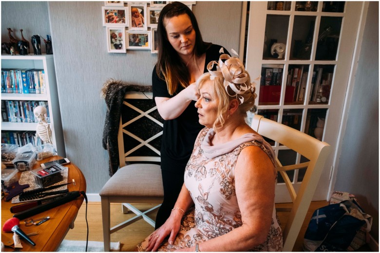 bride and her bridesmaids getting ready for the wedding