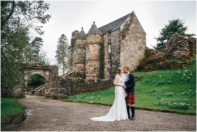 bride and groom in a scottish castle