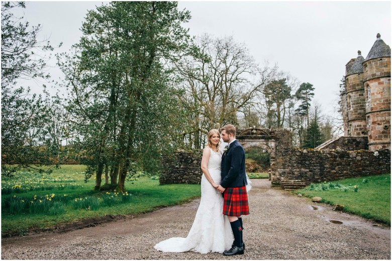 bride and groom in a scottish castle