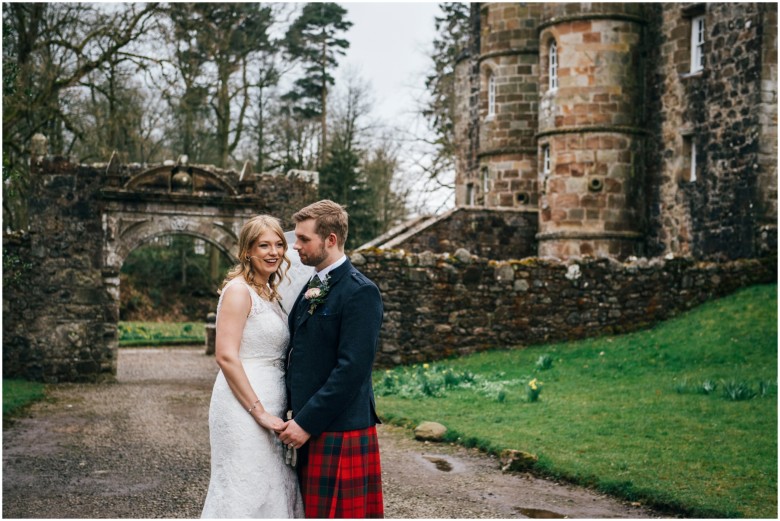 bride and groom in a scottish castle