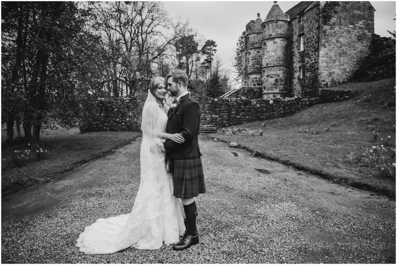 bride and groom in a scottish castle