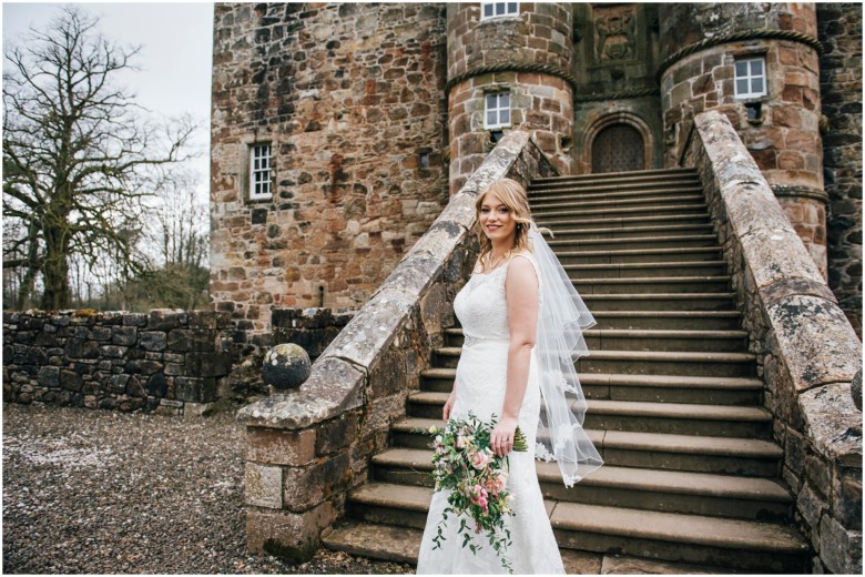 bride and groom in a scottish castle