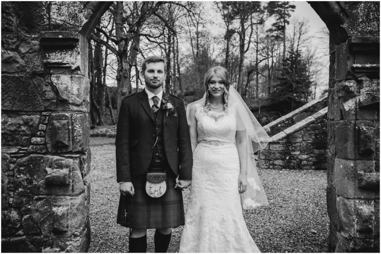 bride and groom in a scottish castle