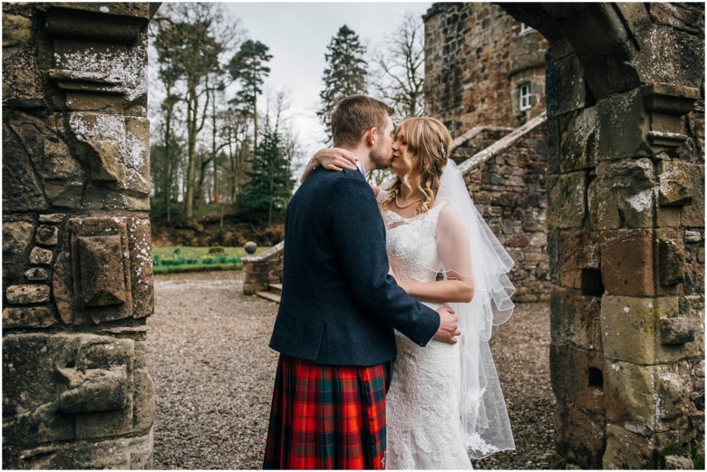 bride and groom in a scottish castle