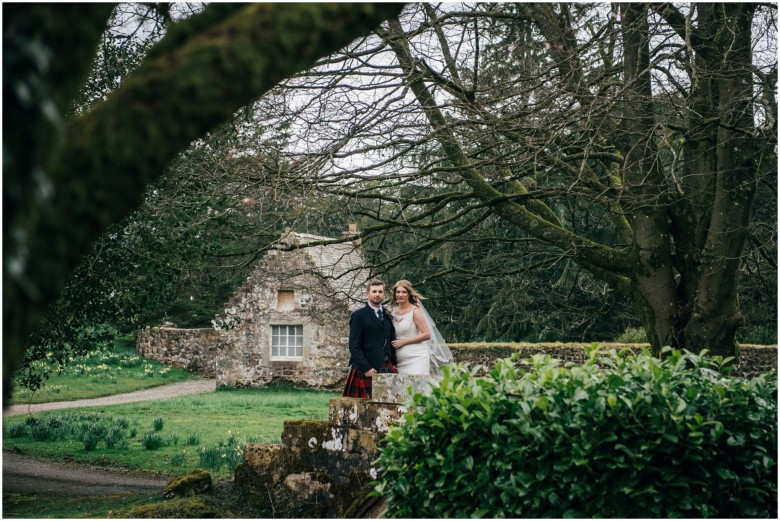 bride and groom in a scottish castle