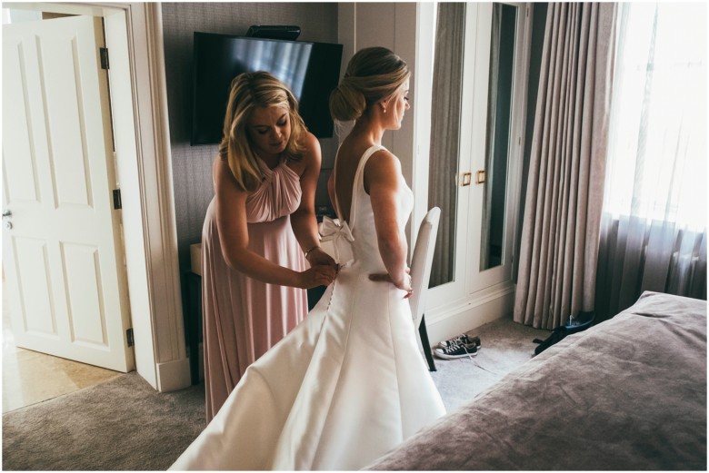 bride and her bridesmaids getting ready for the wedding