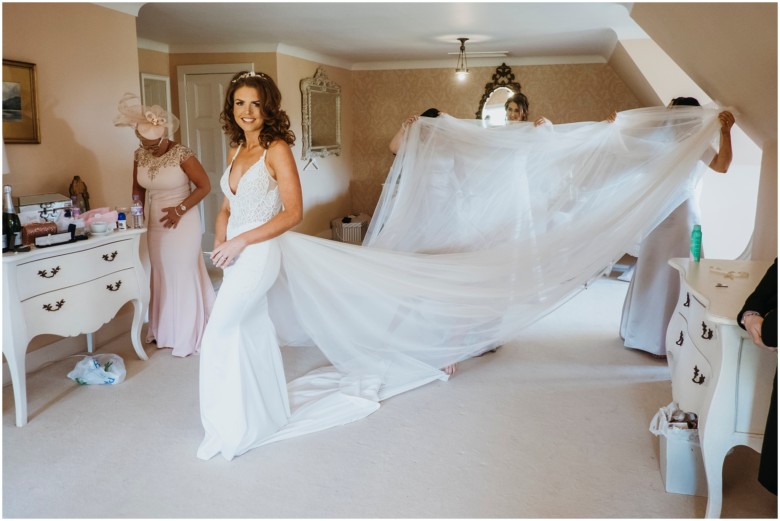 bride and her bridesmaids getting ready for the wedding