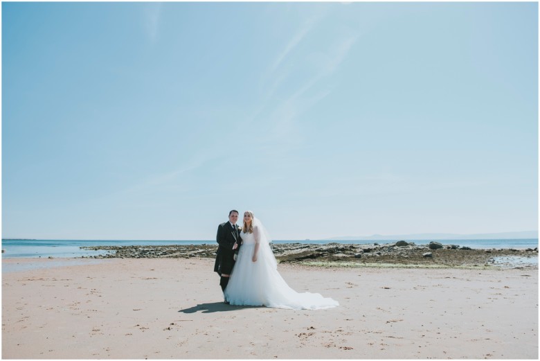 bride and groom on the beach