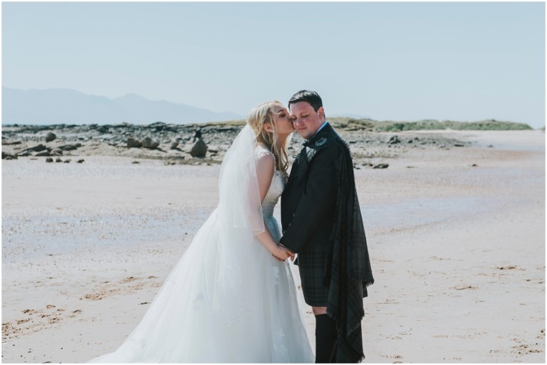 bride and groom on the beach