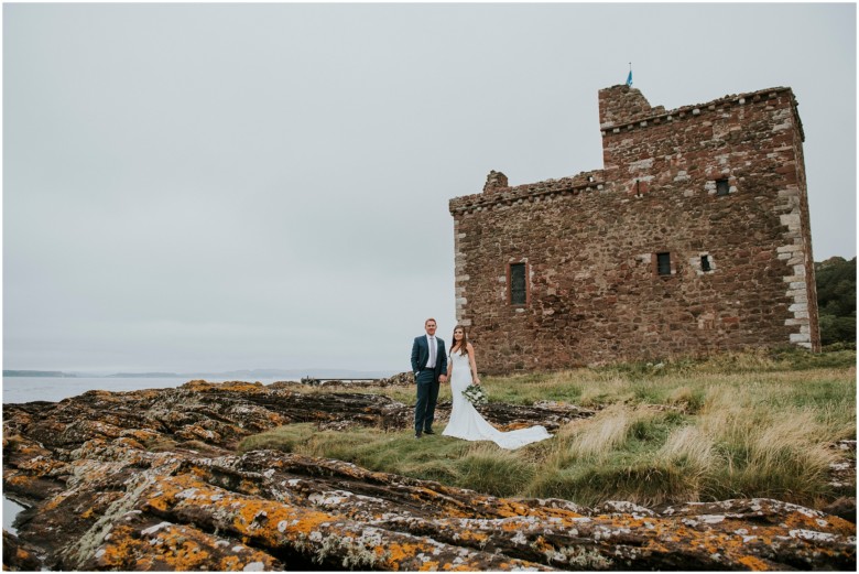 bride and groom photographed at a scottish castle