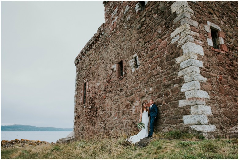 bride and groom photographed at a scottish castle