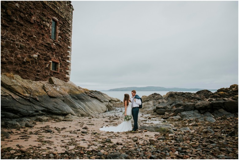 bride and groom photographed at a scottish castle