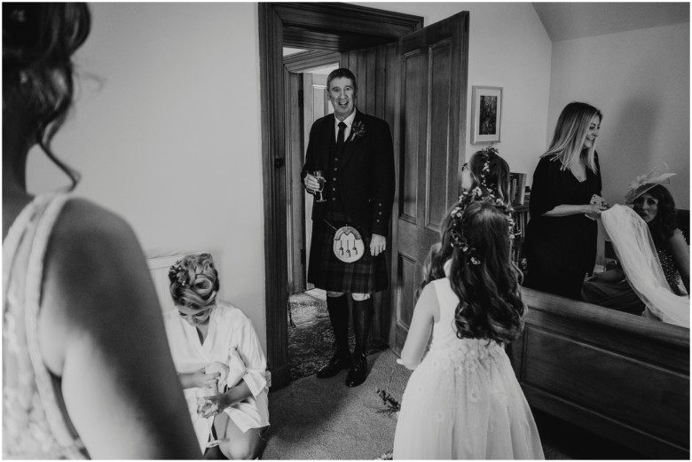 bride and her bridesmaids getting ready for her wedding