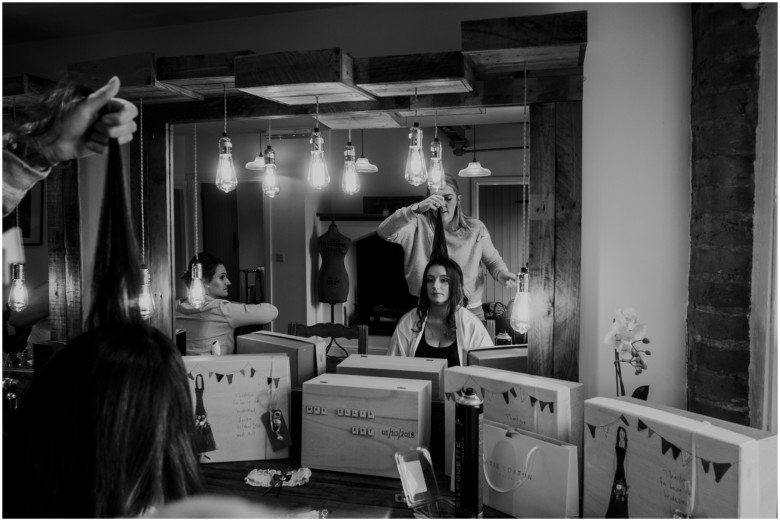 bride and her bridesmaids getting ready