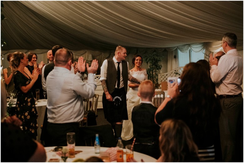 bride and groom cutting the cake