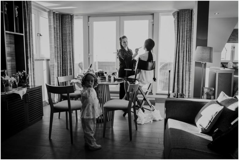 bride and her bridesmaids getting ready