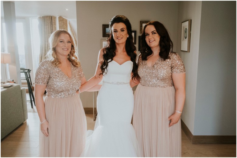 bride and her bridesmaids getting ready