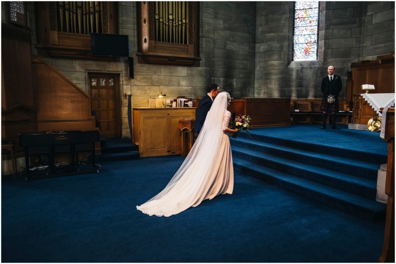 bride and groom at their wedding ceremony in a church