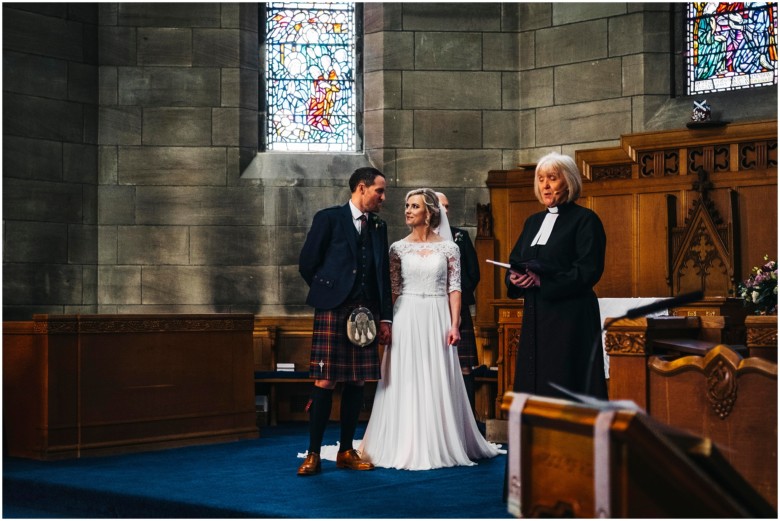 bride and groom at their wedding ceremony in a church