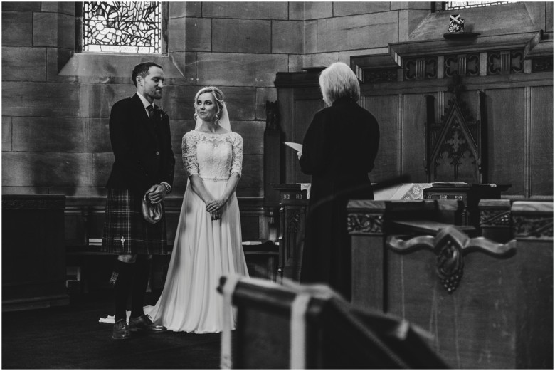 bride and groom at their wedding ceremony in a church