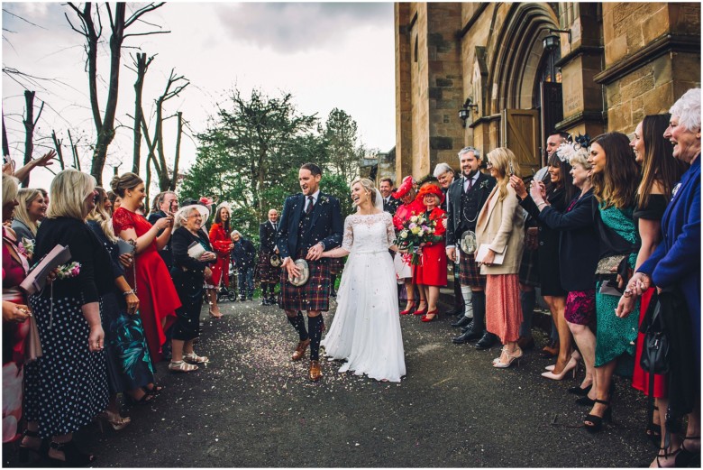 bride and groom leaving the church