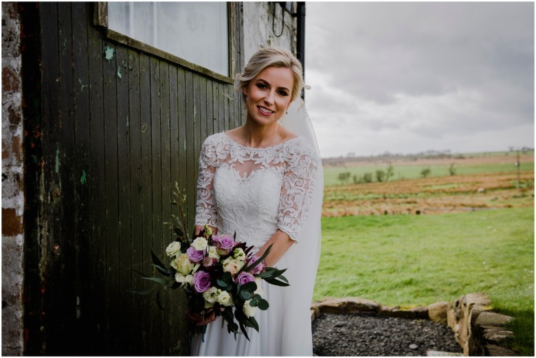 bride and groom at their rustic barn wedding