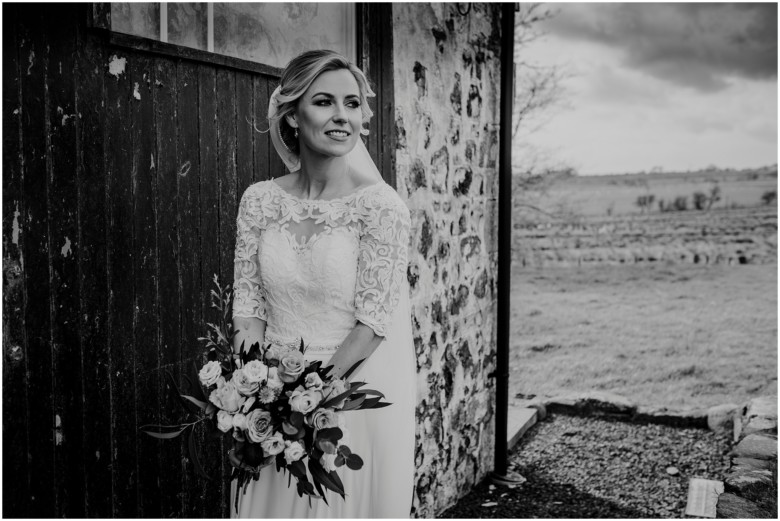 bride and groom at their rustic barn wedding