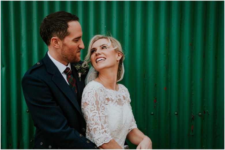 bride and groom at their rustic barn wedding