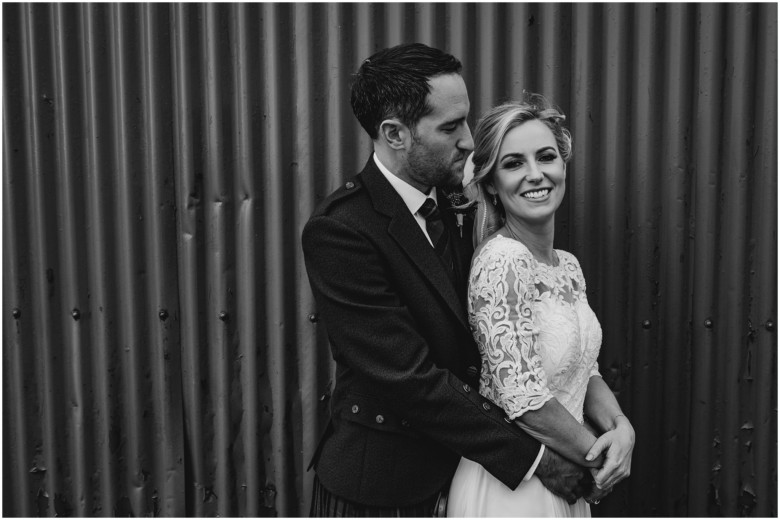 bride and groom at their rustic barn wedding