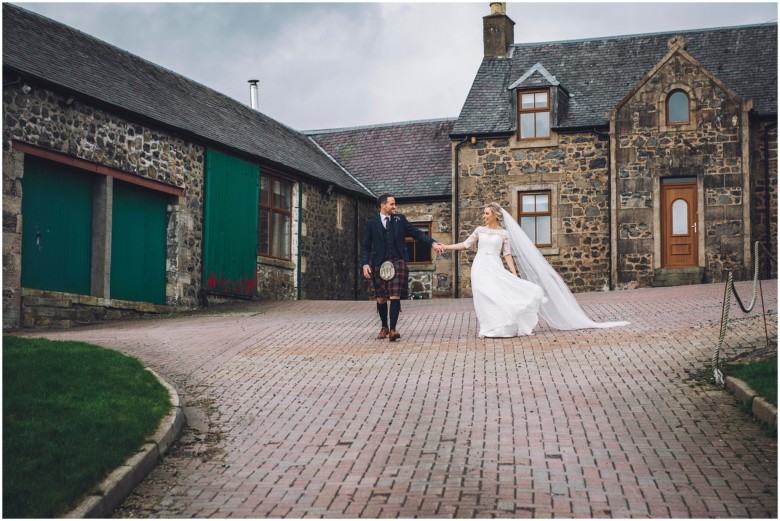 bride and groom at their rustic barn wedding