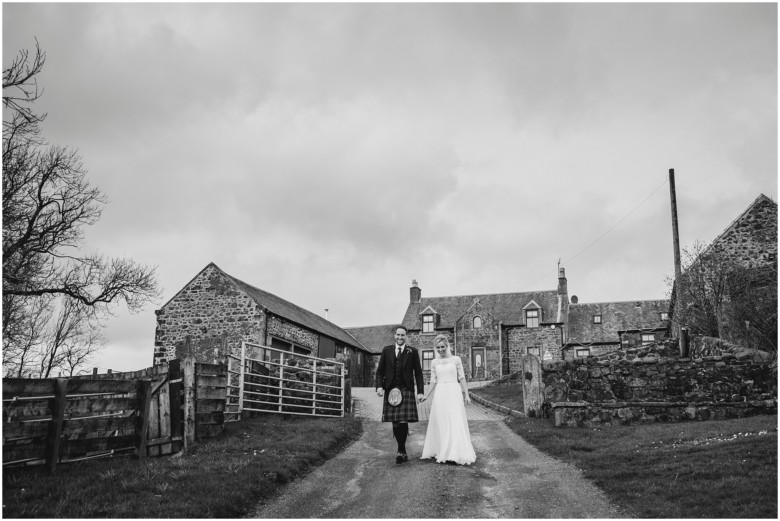 bride and groom at their rustic barn wedding