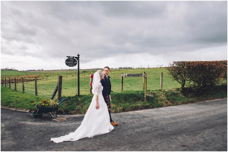 bride and groom at their rustic barn wedding