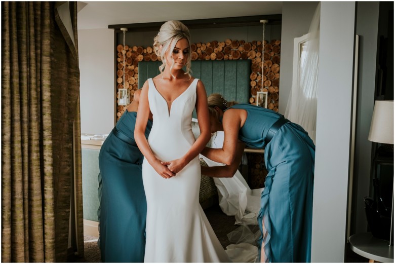 bride and her bridesmaids getting ready