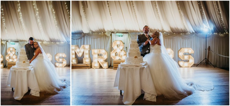 bride and groom cutting the cake