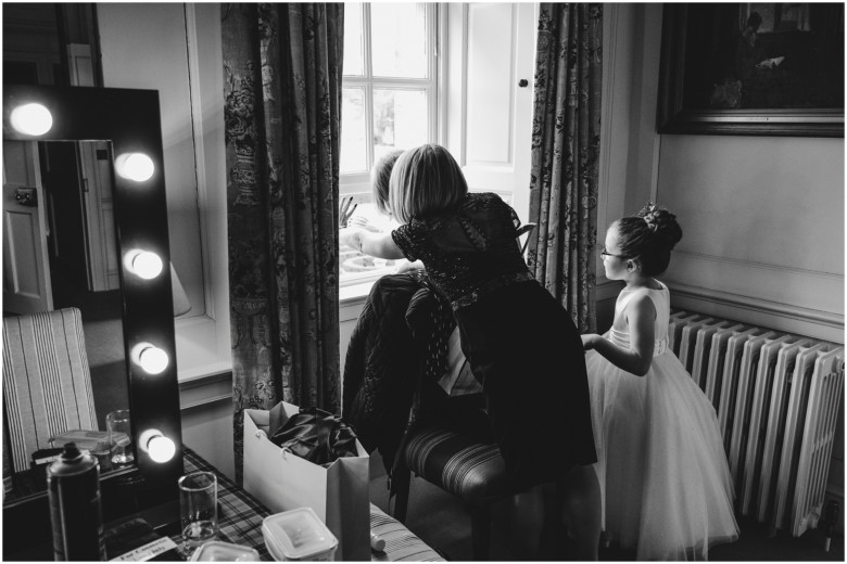 bride and her bridesmaids getting ready