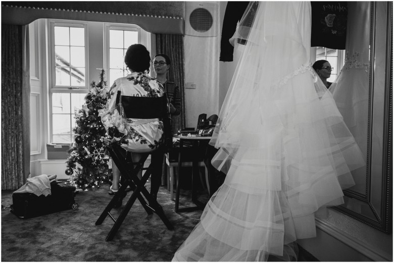 bride and her bridesmaids getting ready